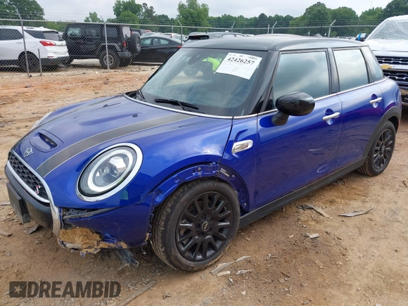 2021 MINI Hardtop 4 Door Cooper S with VIN WMWXU9C00M2N60370, listed as a IAAI auction lot 42426257 with 11,288 mi miles and . Bid and sale history available at DreamBid. Image 2.