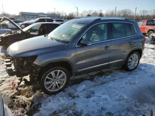 2014 Volkswagen Tiguan SE z VIN WVGAV3AXXEW505398, wystawiony jako Copart lot #41682155 z przebiegiem 137 147 mil mil oraz Nie do naprawy • Non repairable. Historia ofert i sprzedaży dostępna na DreamBid. Obrazek 1.