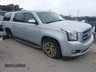 2017 GMC Yukon XL SLT z VIN 1GKS1GKC1HR342834, wystawiony jako IAAI lot #42211054 z przebiegiem 95 848 mil mil oraz . Historia ofert i sprzedaży dostępna na DreamBid. Obrazek 1.