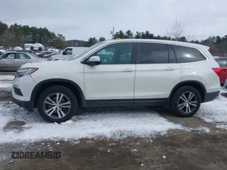 2017 Honda Pilot EX-L with VIN 5FNYF6H52HB015651, listed as a IAAI auction lot 41538814 with 121,433 mi miles and . Bid and sale history available at DreamBid. Image 14.