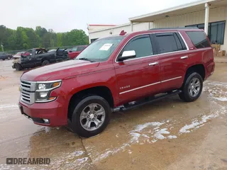 2017 Chevrolet Tahoe LT with VIN 1GNSKBKCXHR270034, listed as a IAAI auction lot 42036132 with 144,530 mi miles. Bid and sale history available at carsss.com. Image 2.