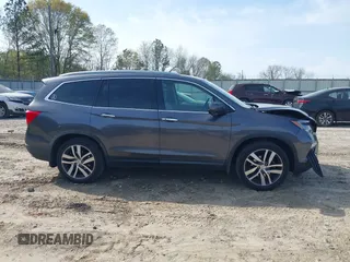 2017 Honda Pilot Touring with VIN 5FNYF5H9XHB046479, listed as a IAAI auction lot 41941449 with 162,554 mi miles. Bid and sale history available at carsss.com. Image 13.