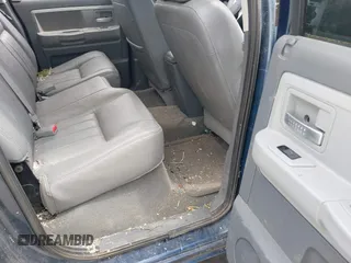 2005 Dodge Dakota Laramie with VIN 1D7HW58NX5S227633, listed as a IAAI auction lot 42122619 with 85,338 mi miles and . Bid and sale history available at DreamBid. Image 8.