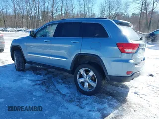2013 Jeep Grand Cherokee Overland with VIN 1C4RJFCTXDC541770, listed as a IAAI auction lot 41610600 with 164,065 mi miles. Bid and sale history available at carsss.com. Image 3.