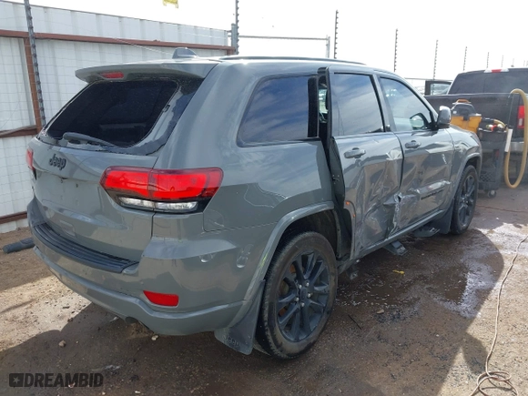 2021 Jeep Grand Cherokee Laredo X with VIN 1C4RJEAG5MC824738, listed as a IAAI auction lot 41580995 with 57,923 mi miles. Bid and sale history available at carsss.com. Image 4.