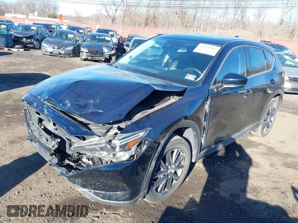 2017 Mazda CX-5 Grand Touring with VIN JM3KFBDL0H0104806, listed as a IAAI auction lot 41621964 with 60,728 mi miles. Bid and sale history available at carsss.com. Image 2.