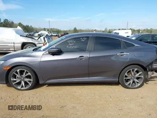 2020 Honda Civic Sedan Touring with VIN 19XFC1F97LE001901, listed as a IAAI auction lot 41048129 with 67,027 mi miles. Bid and sale history available at carsss.com. Image 14.