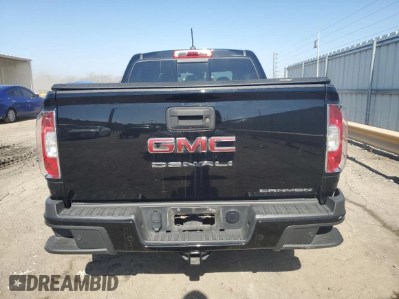 2021 GMC Canyon 4WD Denali with VIN 1GTG6EEN4M1221938, listed as a Copart auction lot 48760965 with 63,231 mi miles and Salvage Title. Bid and sale history available at carsss.com. Image 6.