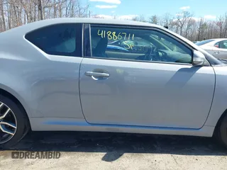 2014 Scion tC with VIN JTKJF5C70E3083839, listed as a IAAI auction lot 41886711 with 118,029 mi miles. Bid and sale history available at carsss.com. Image 13.