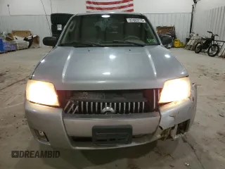 2005 Mercury Mariner Luxury z VIN 4M2CU57135DJ00228, wystawiony jako Copart lot #87603775 z przebiegiem 169 099 mil mil oraz Szkody całkowita. Historia ofert i sprzedaży dostępna na DreamBid. Obrazek 5.