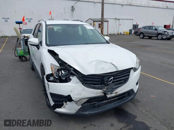 2016 Mazda CX-5 Sport with VIN JM3KE4BY7G0764563, listed as a IAAI auction lot 42279993 with 128,950 mi miles and . Bid and sale history available at DreamBid. Image 6.
