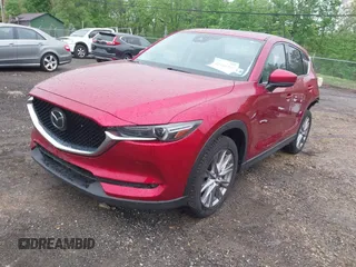 2020 Mazda CX-5 Grand Touring with VIN JM3KFBDM7L1731837, listed as a IAAI auction lot 42160795 with 63,826 mi miles and . Bid and sale history available at DreamBid. Image 18.