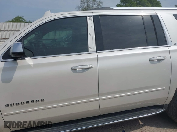 2015 Chevrolet Suburban LTZ with VIN 1GNSCKKC5FR740352, listed as a IAAI auction lot 39075234 with 112,945 mi miles and . Bid and sale history available at DreamBid. Image 15.