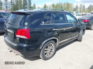 2012 Kia Sorento SX with VIN 5XYKWDA26CG258262, listed as a IAAI auction lot 42068704 with 124,832 mi miles. Bid and sale history available at carsss.com. Image 4.