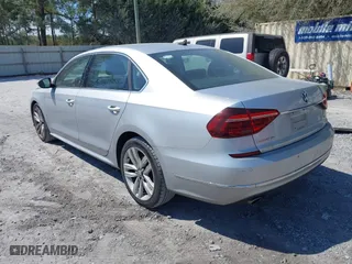 2017 Volkswagen Passat 1.8T SE w/Technology with VIN 1VWGT7A3XHC025096, listed as a IAAI auction lot 41891297 with 124,375 mi miles. Bid and sale history available at carsss.com. Image 3.