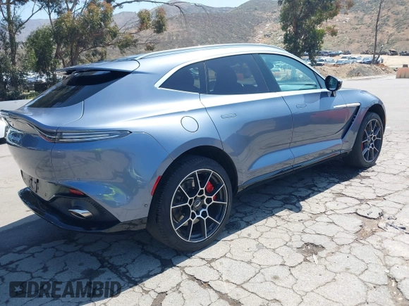 2021 Aston Martin DBX z VIN SCFVUJAW8MTV02568, wystawiony jako IAAI lot #42183964 z przebiegiem 53 608 mil mil oraz . Historia ofert i sprzedaży dostępna na DreamBid. Obrazek 4.