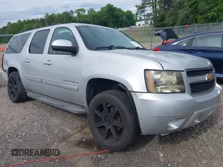 2014 Chevrolet Suburban LT z VIN 1GNSCJE0XER203597, wystawiony jako IAAI lot #42215407 z przebiegiem 186 556 mil mil oraz . Historia ofert i sprzedaży dostępna na DreamBid. Obrazek 1.