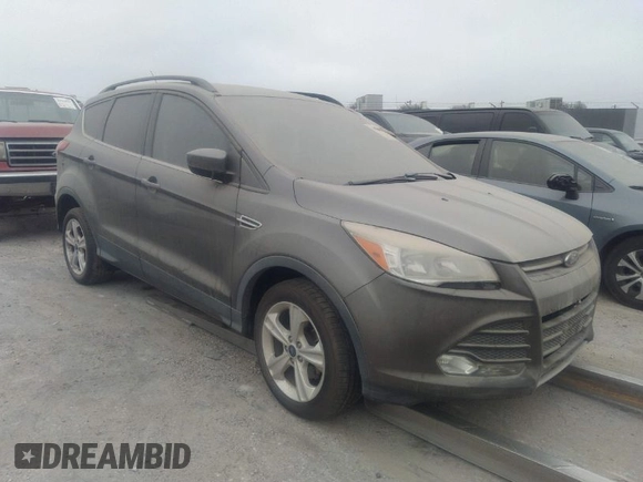 2014 Ford Escape SE with VIN 1FMCU0GXXEUA77765, listed as a IAAI auction lot 40158558 with 88,373 mi miles. Bid and sale history available at carsss.com. Image 1.