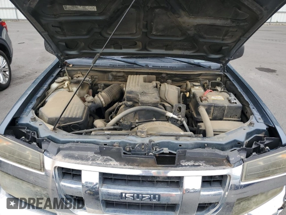 2006 Isuzu i-Series S z VIN 1GGCS198868704462, wystawiony jako Copart lot #71815954 z przebiegiem 107 959 mil mil oraz Szkody całkowita. Historia ofert i sprzedaży dostępna na DreamBid. Obrazek 12.
