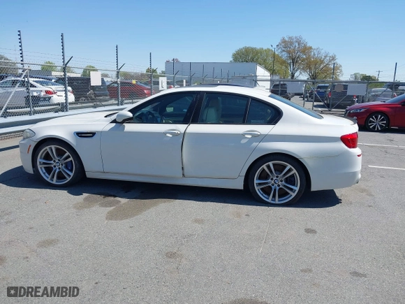 2013 BMW M5 with VIN WBSFV9C58DC773268, listed as a IAAI auction lot 41890830 with 128,399 mi miles. Bid and sale history available at carsss.com. Image 14.