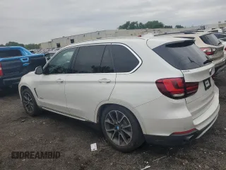 2017 BMW X5 xDrive35i with VIN 5UXKR0C56H0V68771, listed as a Copart auction lot 59587015 with 164,990 mi miles and Salvage title. Bid and sale history available at DreamBid. Image 2.