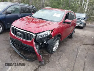 2016 Kia Sorento LX with VIN 5XYPG4A54GG085344, listed as a IAAI auction lot 41981886 with 143,686 mi miles. Bid and sale history available at carsss.com. Image 2.