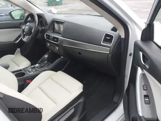 2016 Mazda CX-5 Grand Touring z VIN JM3KE4DY0G0705884, wystawiony jako IAAI lot #42016910 z przebiegiem 73 324 mil mil oraz . Historia ofert i sprzedaży dostępna na DreamBid. Obrazek 5.