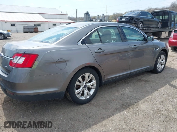 2012 Ford Taurus SEL z VIN 1FAHP2EWXCG138038, wystawiony jako IAAI lot #42007614 z przebiegiem 155 045 mil mil oraz . Historia ofert i sprzedaży dostępna na DreamBid. Obrazek 4.