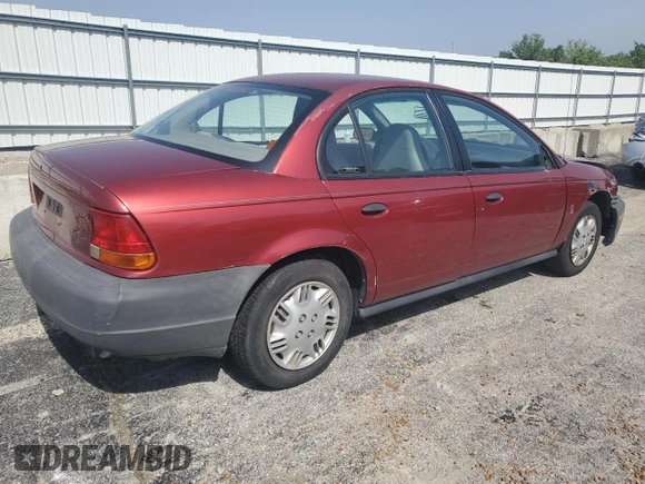 1999 Saturn SL z VIN 1G8ZH5288XZ273509, wystawiony jako Copart lot #55508215 z przebiegiem 168 946 mil mil oraz Szkoda całkowita • Salvage title. Historia ofert i sprzedaży dostępna na DreamBid. Obrazek 3.