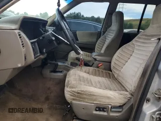 1995 Jeep Grand Cherokee Laredo with VIN 1J4GZ58S2SC703196, listed as a Copart auction lot 68571944 with 264,876 mi miles and Clean Title. Bid and sale history available at carsss.com. Image 7.