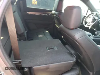 2023 Cadillac XT5 FWD Luxury z VIN 1GYKNAR4XPZ144533, wystawiony jako Copart lot #74734164 z przebiegiem Nie podano mil oraz Nie do naprawy • Non repairable. Historia ofert i sprzedaży dostępna na DreamBid. Obrazek 12.