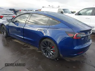 2022 Tesla Model 3 Performance with VIN 5YJ3E1EC7NF306192, listed as a IAAI auction lot 41453931 with 36,450 mi miles. Bid and sale history available at carsss.com. Image 3.