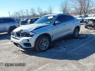 2018 BMW X6 xDrive35i with VIN 5UXKU2C50J0X51275, listed as a IAAI auction lot 41421704 with 165,052 mi miles. Bid and sale history available at carsss.com. Image 2.