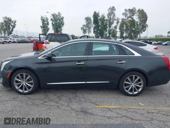 2013 Cadillac XTS Luxury with VIN 2G61P5S33D9215214, listed as a IAAI auction lot 42170402 with 132,045 mi miles and . Bid and sale history available at DreamBid. Image 14.