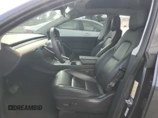 2021 Tesla Model Y Long Range with VIN 5YJYGDEE6MF200883, listed as a Copart auction lot 51707405 with 59,820 mi miles and Salvage Title. Bid and sale history available at DreamBid. Image 7.