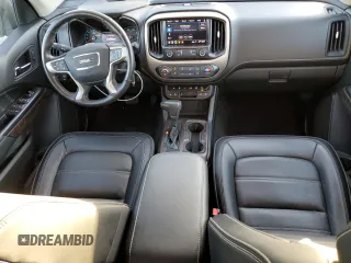 2021 GMC Canyon 2WD Denali with VIN 1GTG5EEN2M1107052, listed as a Copart auction lot 76377704 with 11,696 mi miles and Salvage Title. Bid and sale history available at carsss.com. Image 8.