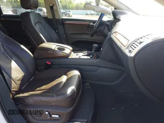 2014 Audi Q7 Premium Plus with VIN WA1LMAFE8ED012398, listed as a IAAI auction lot 42276962 with 131,012 mi miles and . Bid and sale history available at DreamBid. Image 5.