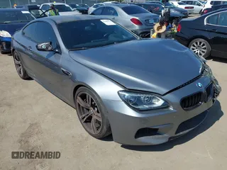 2013 BMW M6 with VIN WBSLX9C51DC968593, listed as a IAAI auction lot 42465979 with 88,010 mi miles and . Bid and sale history available at DreamBid. Image 1.