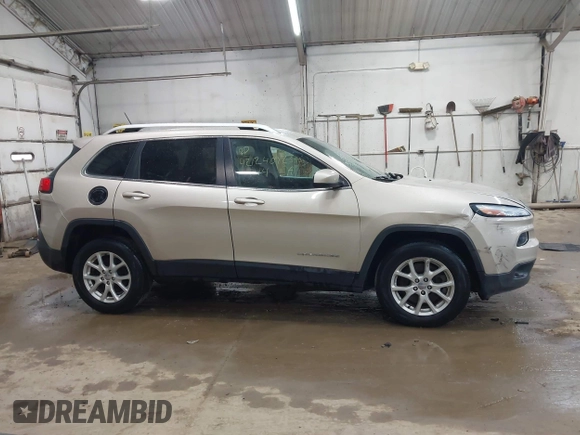 2014 Jeep Cherokee Latitude z VIN 1C4PJMCB0EW291782, wystawiony jako IAAI lot #42124092 z przebiegiem 170 265 mil mil oraz . Historia ofert i sprzedaży dostępna na DreamBid. Obrazek 13.