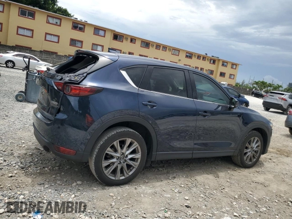 2021 Mazda CX-5 Grand Touring z VIN JM3KFBDM5M0464611, wystawiony jako Copart lot #62829065 z przebiegiem 20 525 mil mil oraz Nie do naprawy • Non repairable. Historia ofert i sprzedaży dostępna na DreamBid. Obrazek 3.