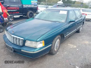 1999 Cadillac DeVille DHS z VIN 1G6KE54Y9XU766791, wystawiony jako IAAI lot #42005553 z przebiegiem 140 515 mil mil oraz . Historia ofert i sprzedaży dostępna na DreamBid. Obrazek 2.