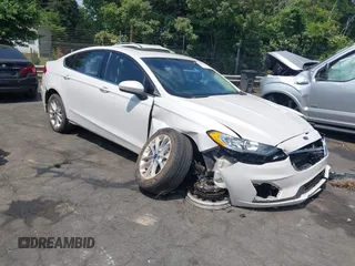 2020 Ford Fusion SE z VIN 3FA6P0LU5LR153942, wystawiony jako IAAI lot #42145638 z przebiegiem 99 961 mil mil oraz . Historia ofert i sprzedaży dostępna na DreamBid. Obrazek 1.