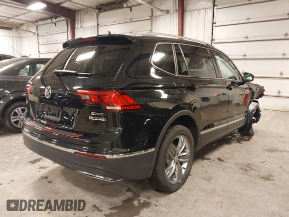 2021 Volkswagen Tiguan SE with VIN 3VV2B7AXXMM034880, listed as a IAAI auction lot 41979636 with 34,490 mi miles and . Bid and sale history available at DreamBid. Image 4.