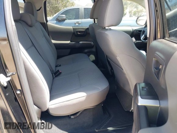 2023 Toyota Tacoma SR with VIN 3TMCZ5AN1PM654572, listed as a IAAI auction lot 42312575 with 14,111 mi miles and . Bid and sale history available at DreamBid. Image 8.