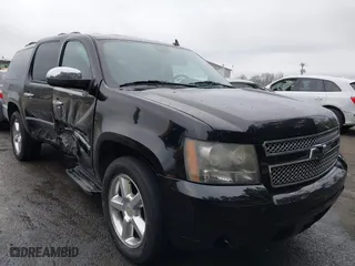 2011 Chevrolet Suburban LTZ with VIN 1GNSCKE02BR206544, listed as a IAAI auction lot 41159341 with 218,202 mi miles. Bid and sale history available at carsss.com. Image 1.