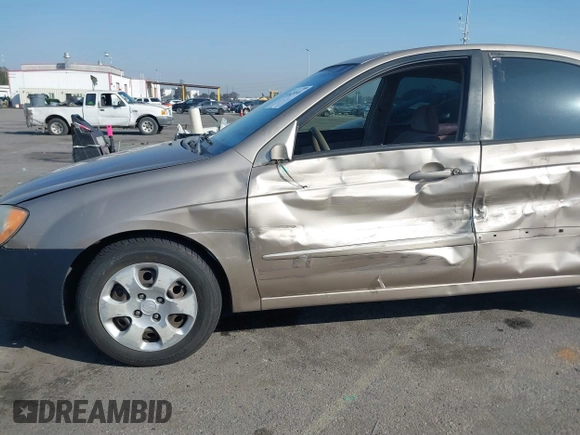 2004 Kia Spectra LX with VIN KNAFE122145013930, listed as a IAAI auction lot 41627031 with 93,565 mi miles. Bid and sale history available at carsss.com. Image 6.
