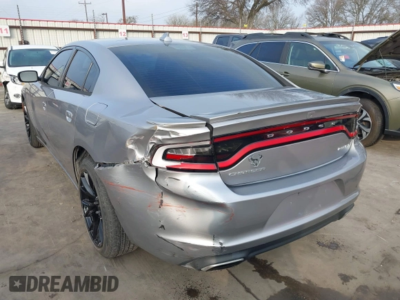 2015 Dodge Charger SXT with VIN 2C3CDXHG4FH884058, listed as a IAAI auction lot 41724894 with 202,701 mi miles and . Bid and sale history available at DreamBid. Image 3.