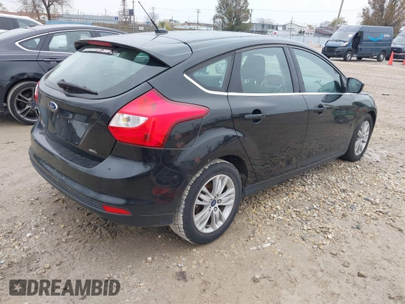 2012 Ford Focus SEL with VIN 1FAHP3M28CL336001, listed as a IAAI auction lot 40876771 with 147,017 mi miles. Bid and sale history available at carsss.com. Image 4.
