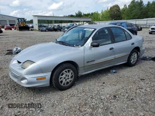 2000 Pontiac Sunfire SE z VIN 1G2JB5249Y7115960, wystawiony jako Copart lot #65038974 z przebiegiem 112 487 mil mil oraz Szkody całkowita. Historia ofert i sprzedaży dostępna na DreamBid. Obrazek 1.