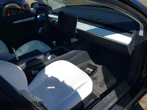 2023 Tesla Model 3 Long Range with VIN 5YJ3E1EB1PF632595, listed as a IAAI auction lot 41754131 with 8,147 mi miles and . Bid and sale history available at DreamBid. Image 5.